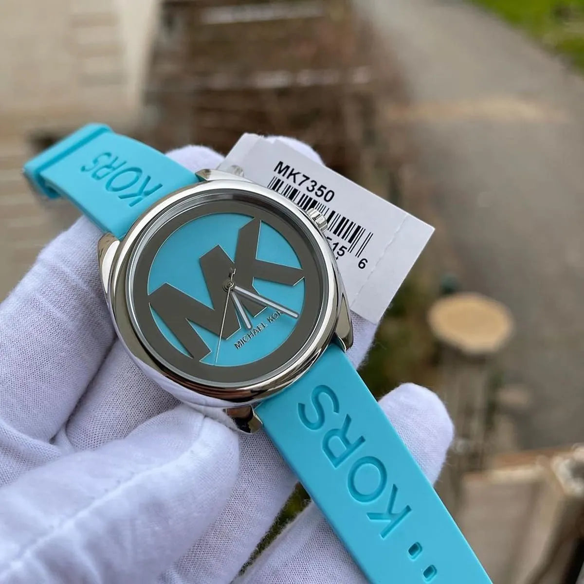 Michael Kors Janelle MK7350 on wrist with retail tag showing model number and packaging