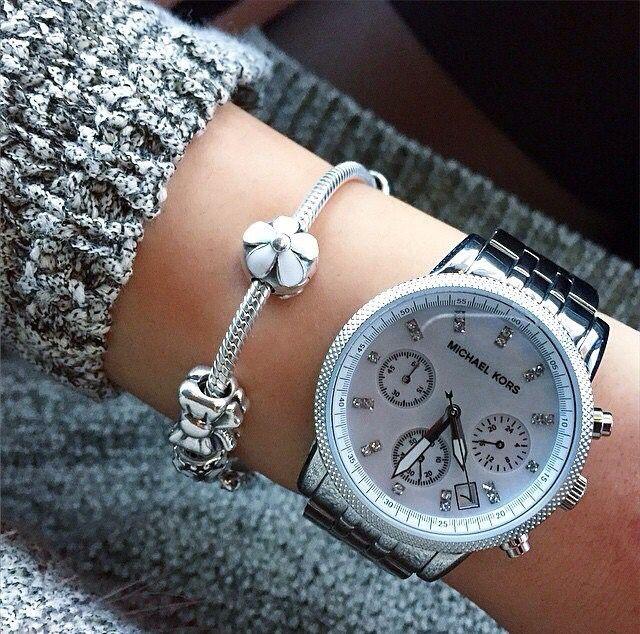 Michael Kors Jet Set Chronograph watch on wrist displaying mother of pearl dial and chronograph function