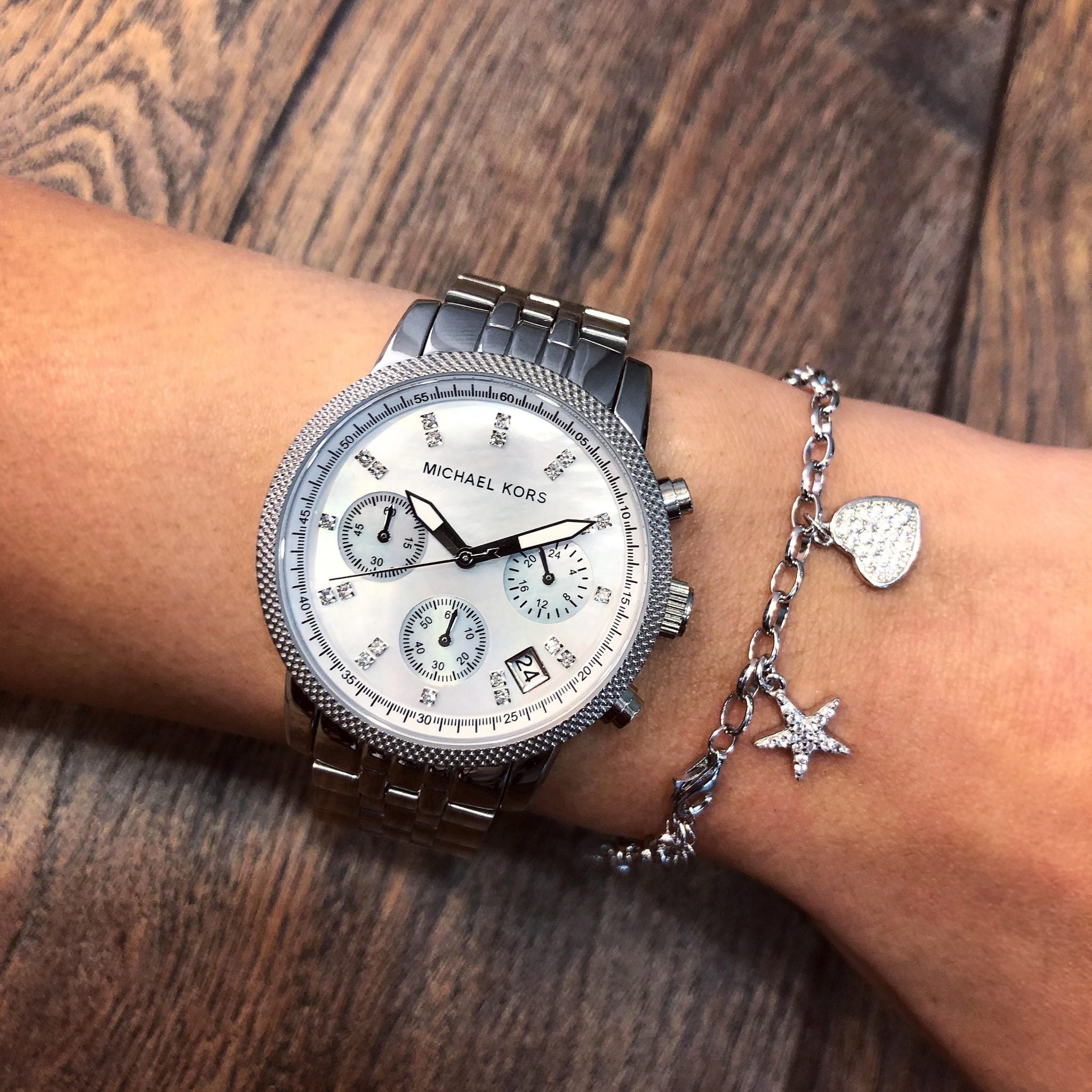 Michael Kors Jet Set Chronograph watch worn on wrist with mother of pearl dial