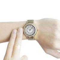 Michael Kors Kerry gold-tone ladies watch worn on wrist showing dial and bracelet
