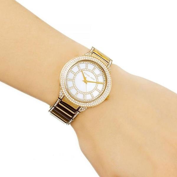 Michael Kors Kerry watch on wrist showing crystal bezel detail and gold-tone case