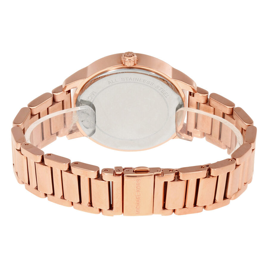 Case back view of Michael Kors Kinley rose gold women's watch showing stainless steel bracelet