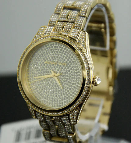 Angled view of Michael Kors Lauryn watch with crystal-set bezel and gold-tone bracelet
