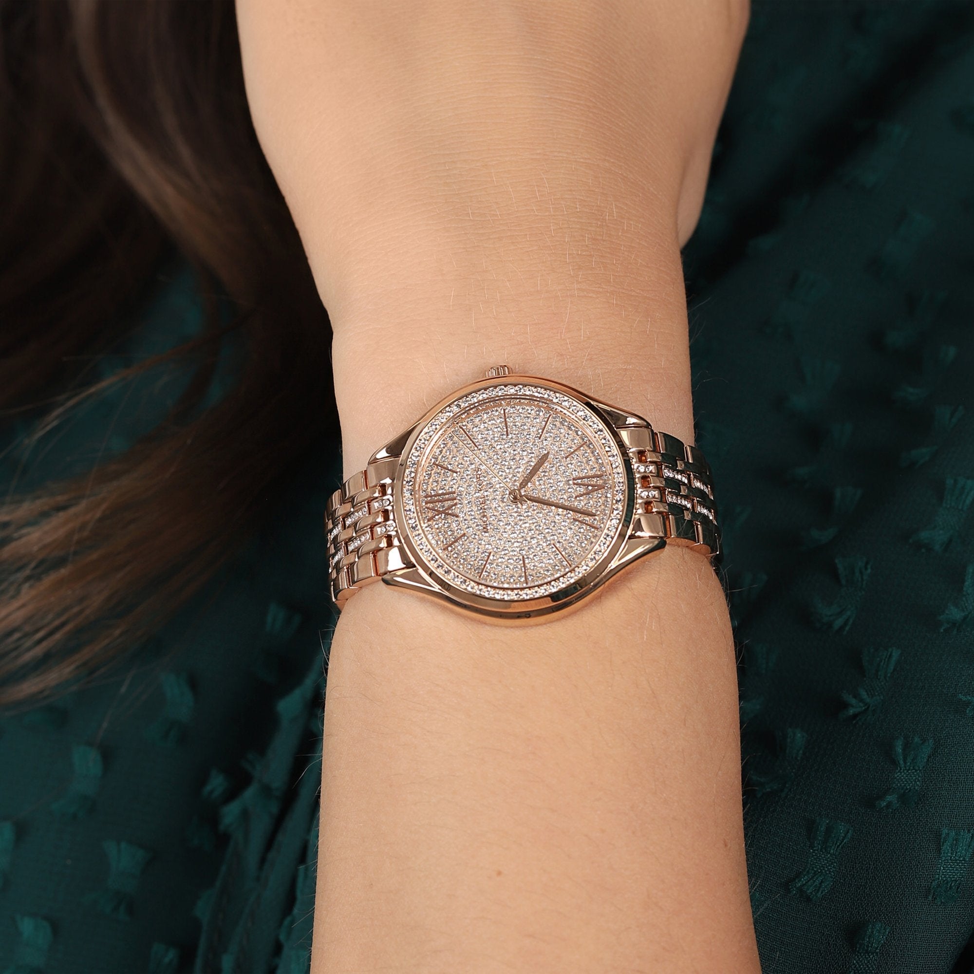 Michael Kors Mindy rose gold watch worn on wrist showing crystal-embellished dial