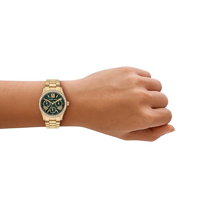 Michael Kors MK4924 watch worn on wrist showing gold bracelet and dark face