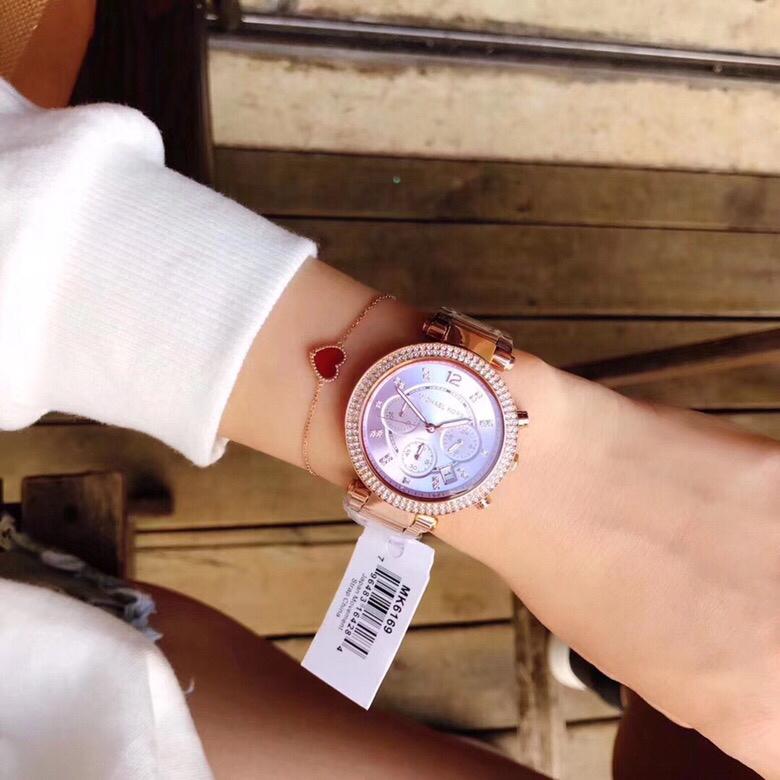 Michael Kors Parker purple dial chronograph watch worn on wrist