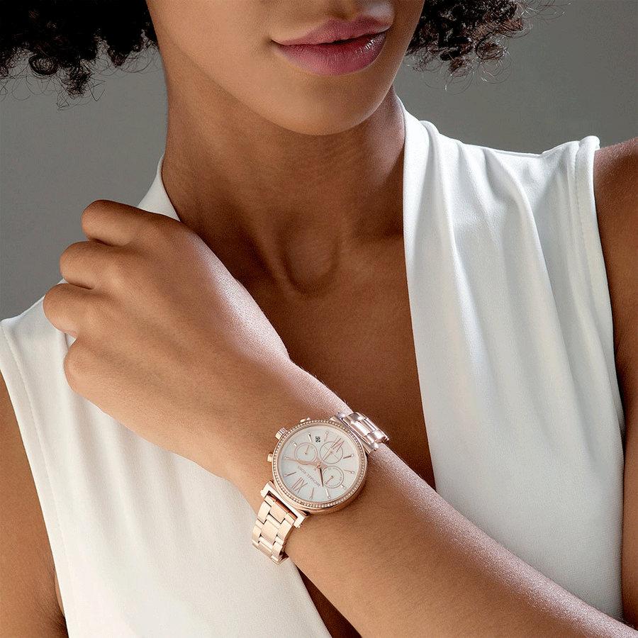 Michael Kors Sofie chronograph watch worn on wrist with rose gold finish and mother of pearl dial