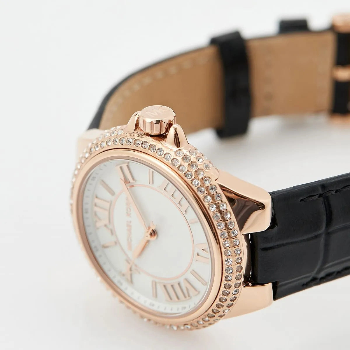 Angled view of Mini Camille watch showing rose gold pavé-set crystal case and black crocodile-embossed leather band