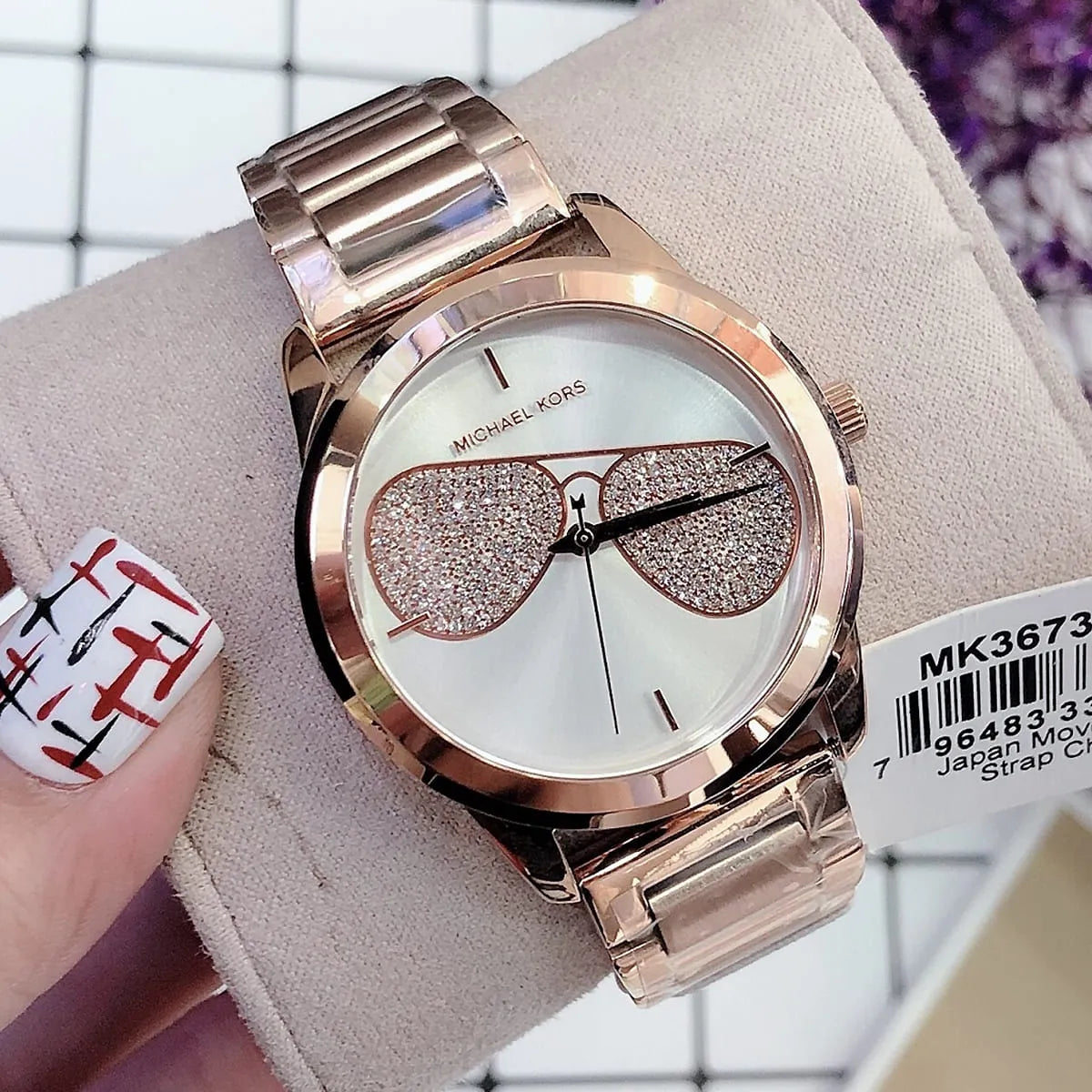 Michael Kors MK3673 on wrist display with product tag and packaging visible