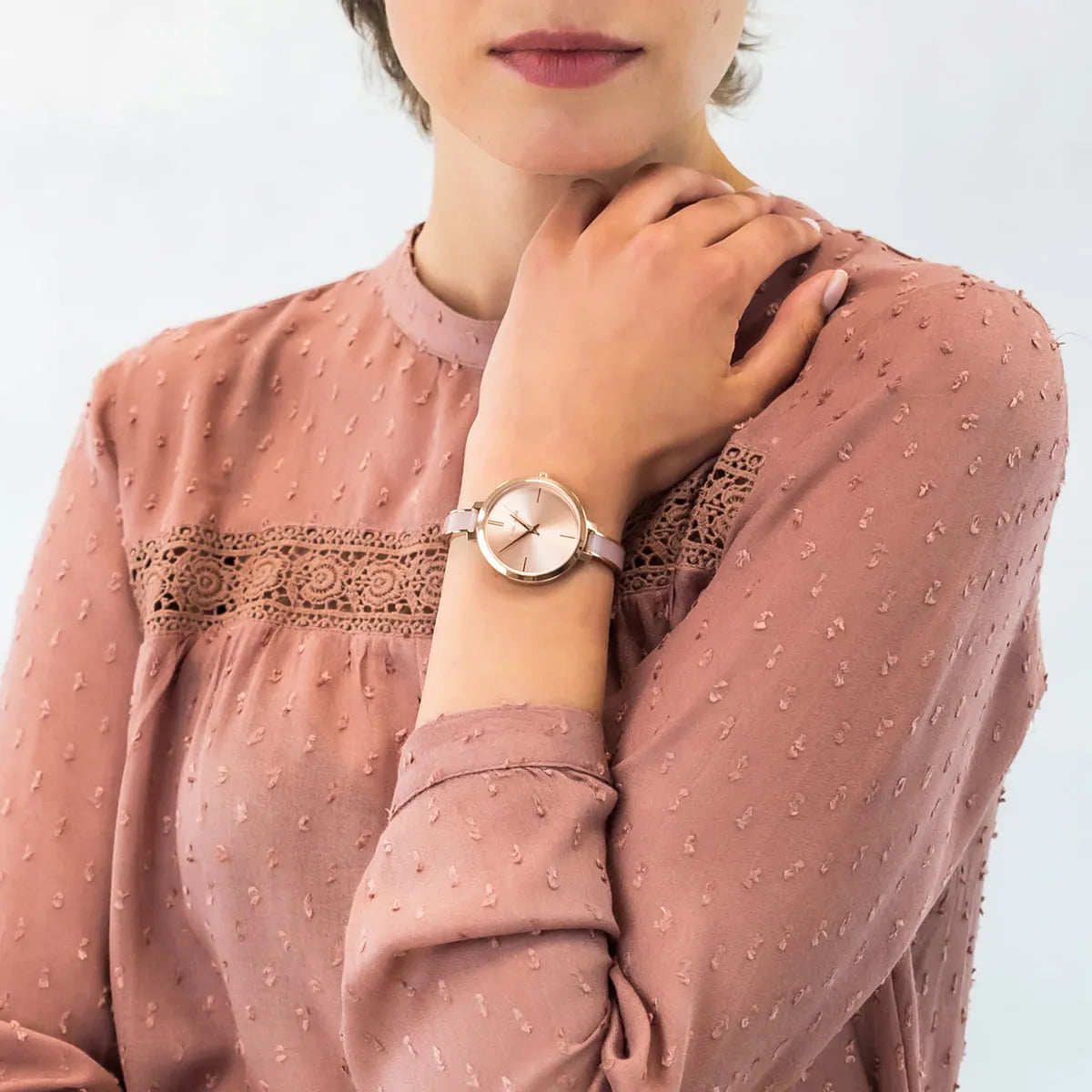 Michael Kors Jaryn watch worn on wrist showing rose gold dial and feminine strap