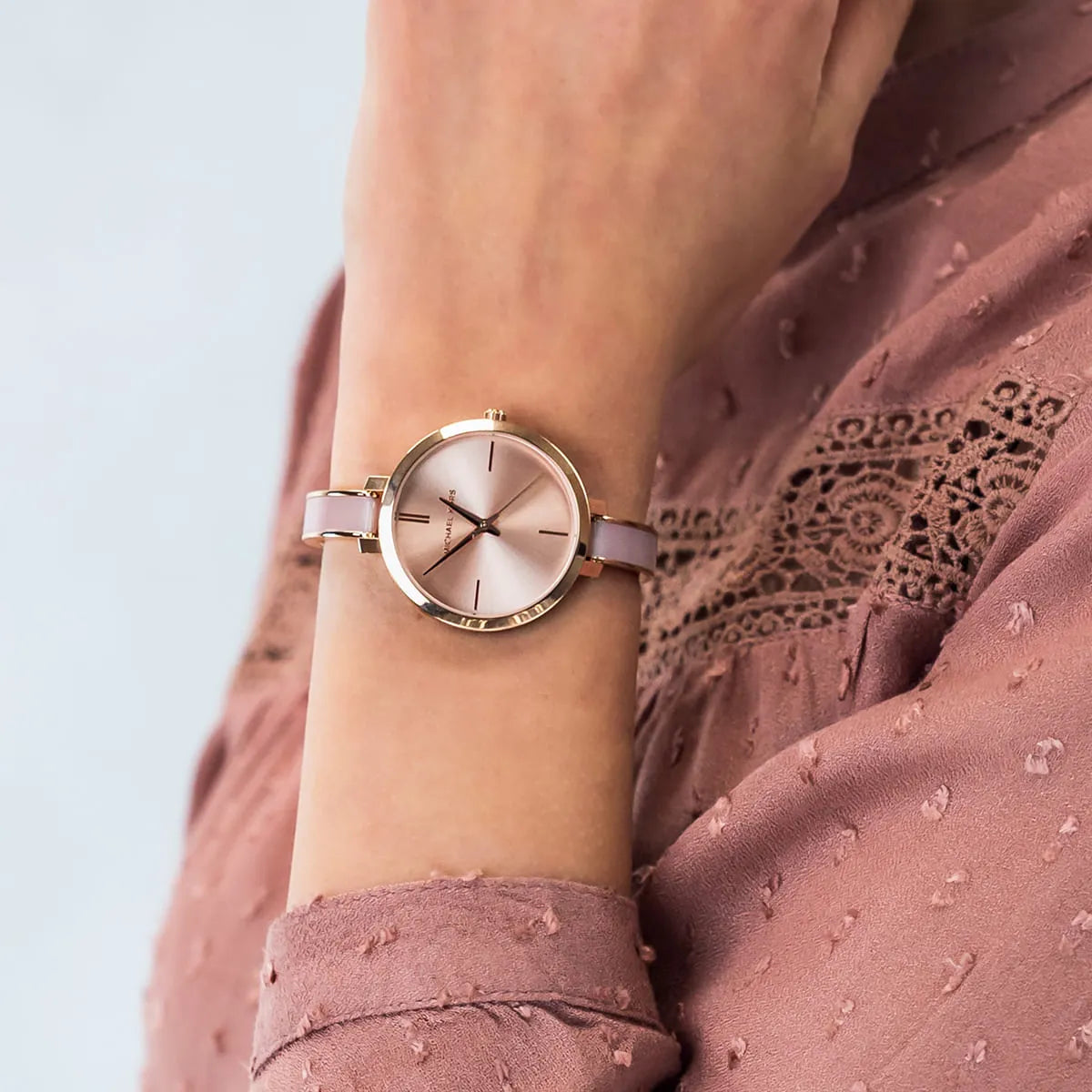 Jaryn women's watch on wrist displaying gold-tone minimalist dial design
