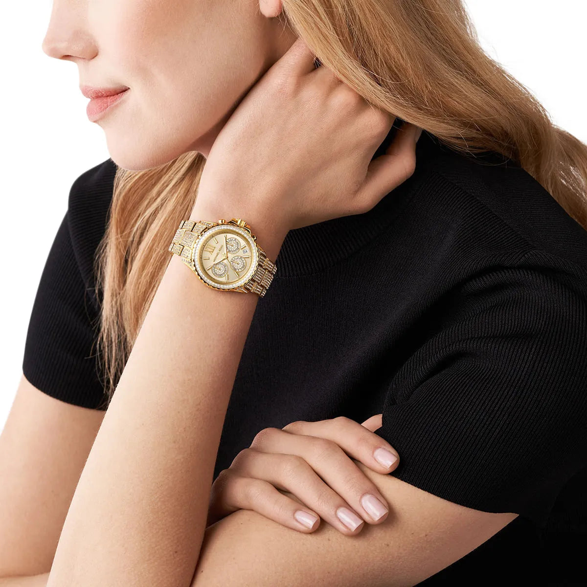Michael Kors Everest MK7254 women's watch worn on wrist, showing cream dial with gold-tone chronograph subdials