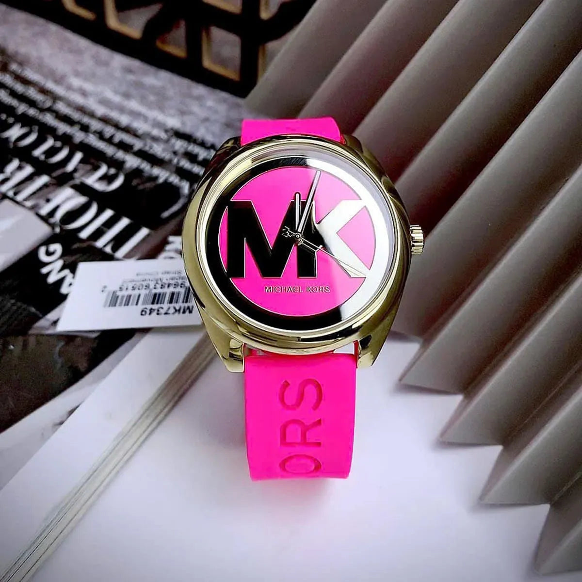 Michael Kors Janelle watch worn on wrist showing pink dial and strap styling