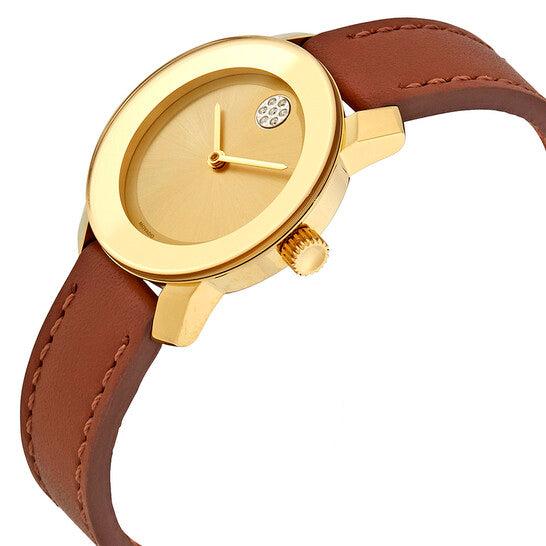 Movado Bold watch on wrist showing gold case and brown leather strap