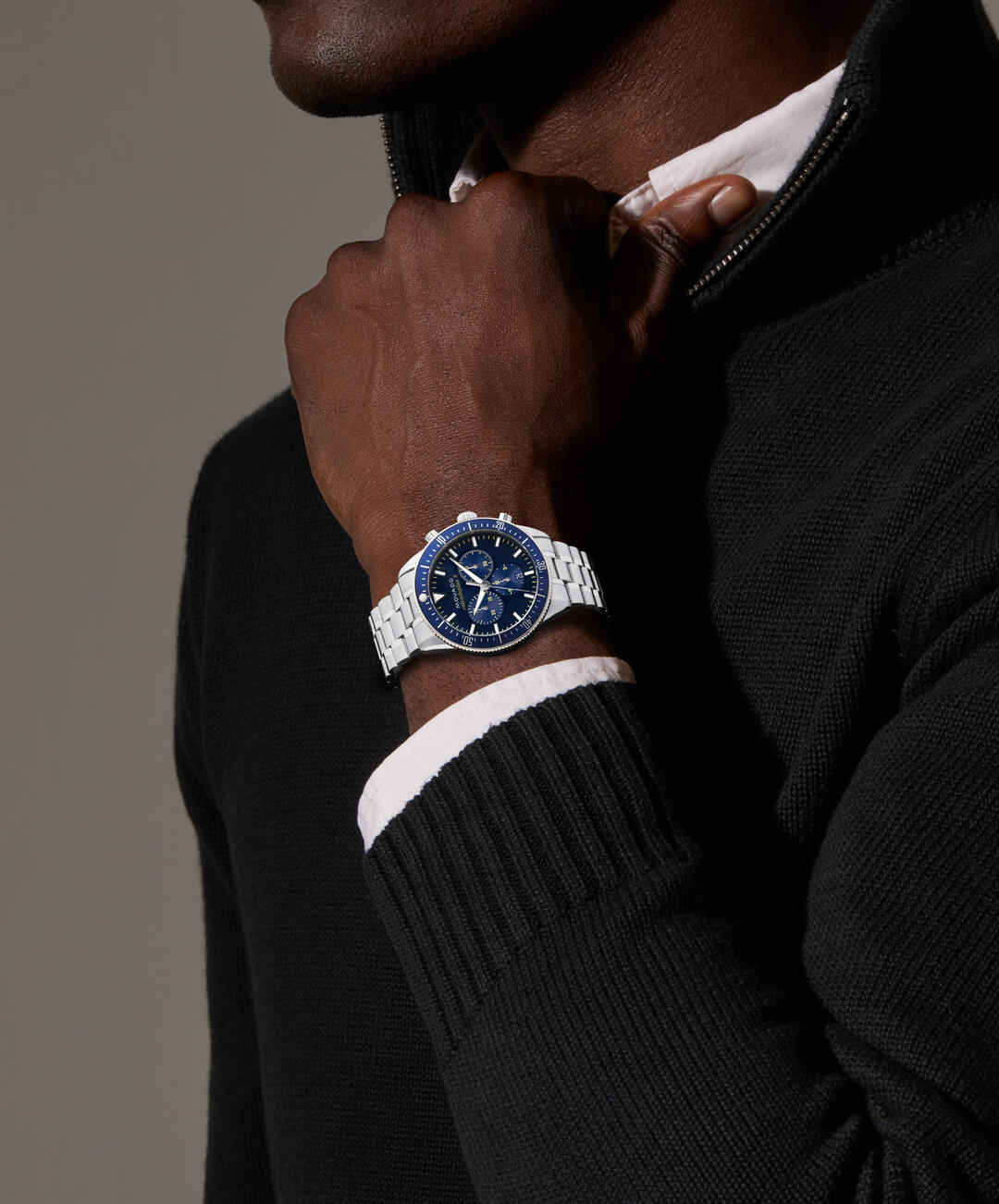 Movado Heritage Chronograph worn on wrist with blue dial and steel bracelet