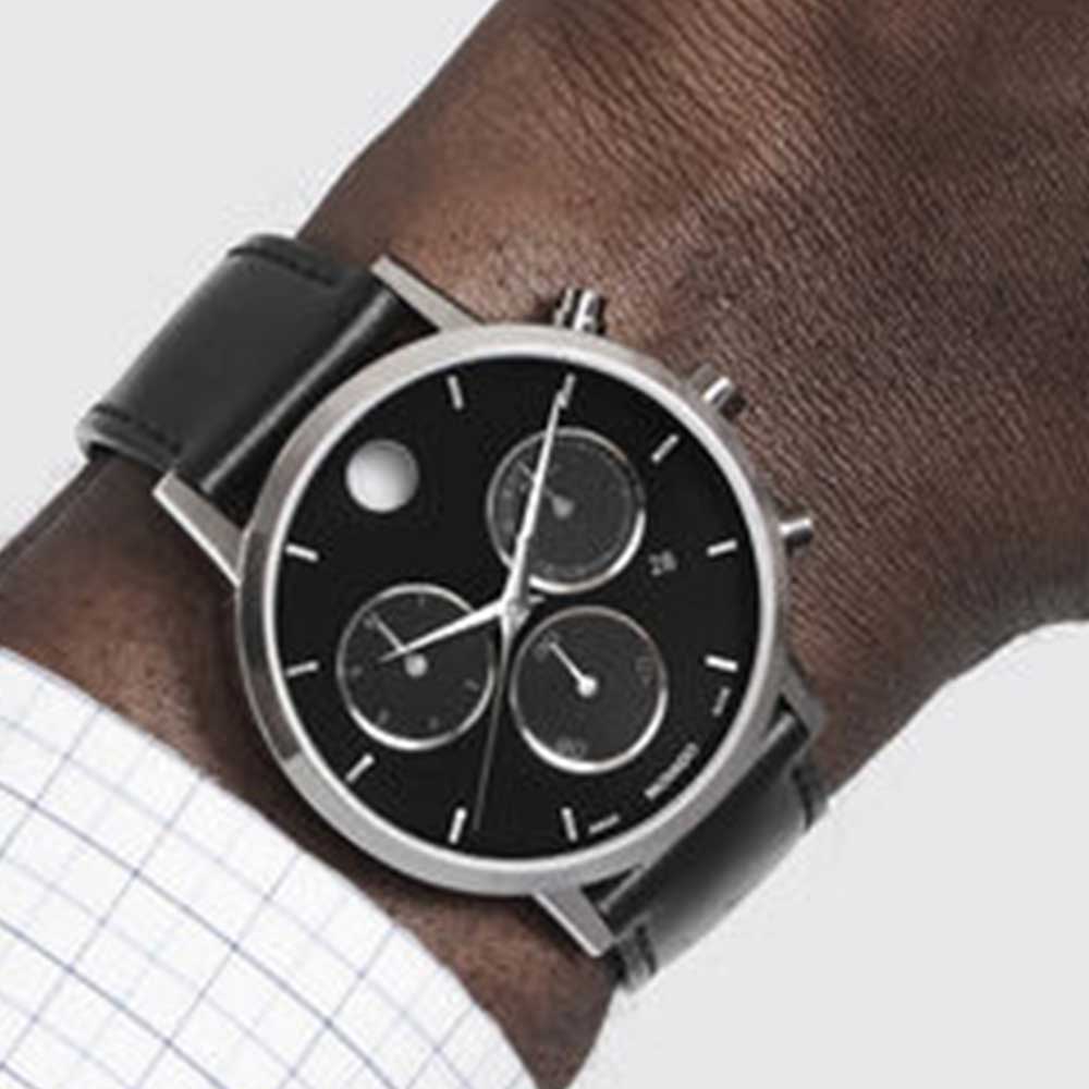 Movado Museum Classic chronograph watch worn on wrist showing black dial with three subdials and stainless steel case