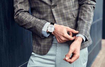 Movado TC Mirror Bezel stainless steel watch on wrist in lifestyle setting