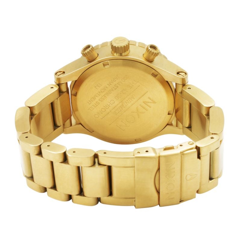 Nixon 42-20 Chrono caseback showing gold-tone metal with engraved details