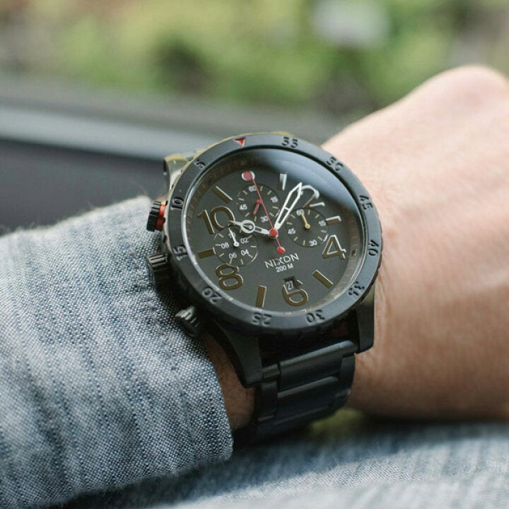 Nixon 48-20 Chrono on-wrist view showing black chronograph watch worn on arm