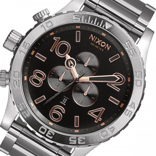 Close-up of Nixon 51-30 dial with rose gold hands and chronograph subdials
