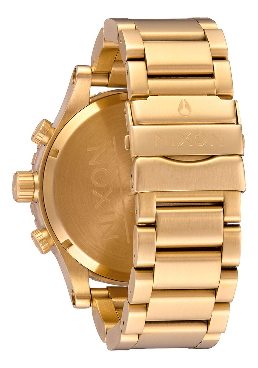 Caseback view of Nixon 51-30 Chrono gold watch showing stamped design