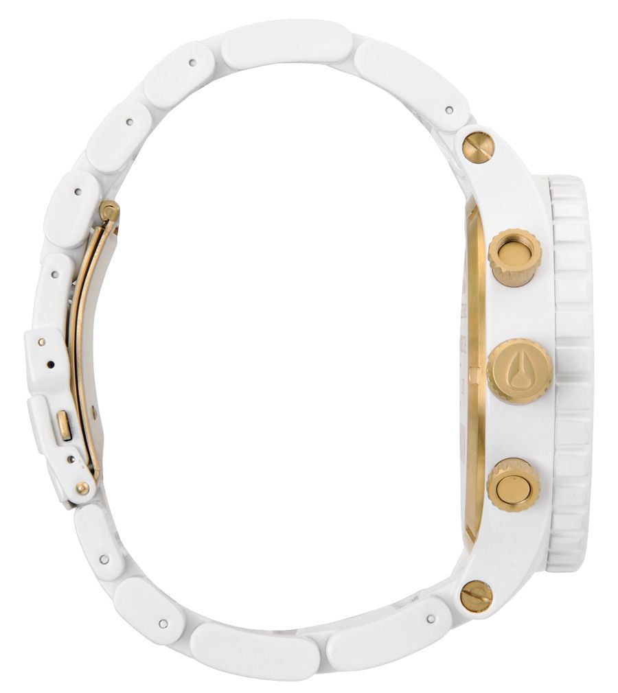 Side view of Nixon 51-30 watch showing white three-link bracelet and gold-tone pusher buttons
