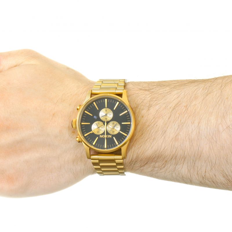 Nixon Sentry Chrono all gold chronograph watch worn on wrist