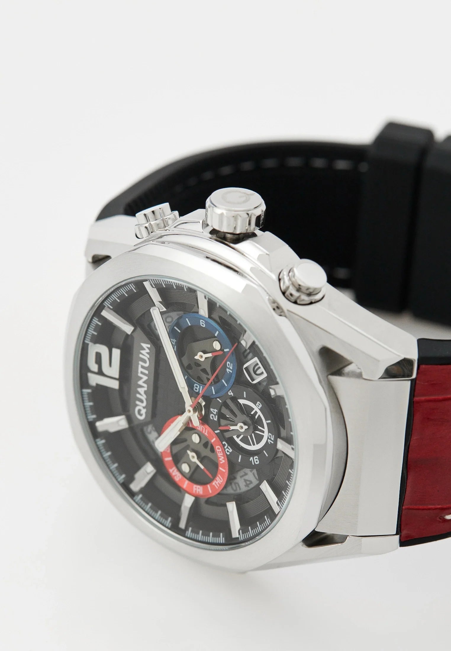Three-quarter angle view of Quantum watch with red silicon strap and pushers visible