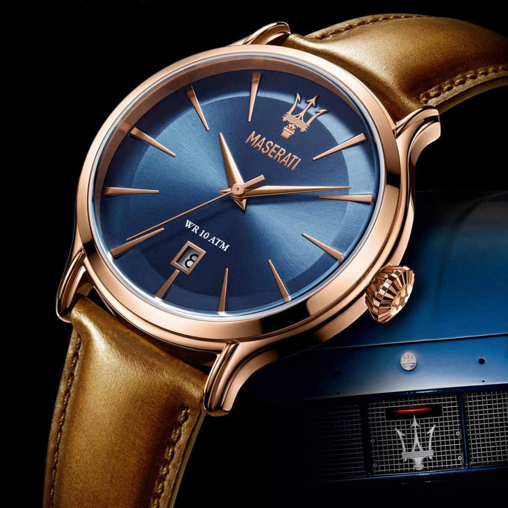 Maserati Epoca watch with blue dial and brown leather strap on blue car