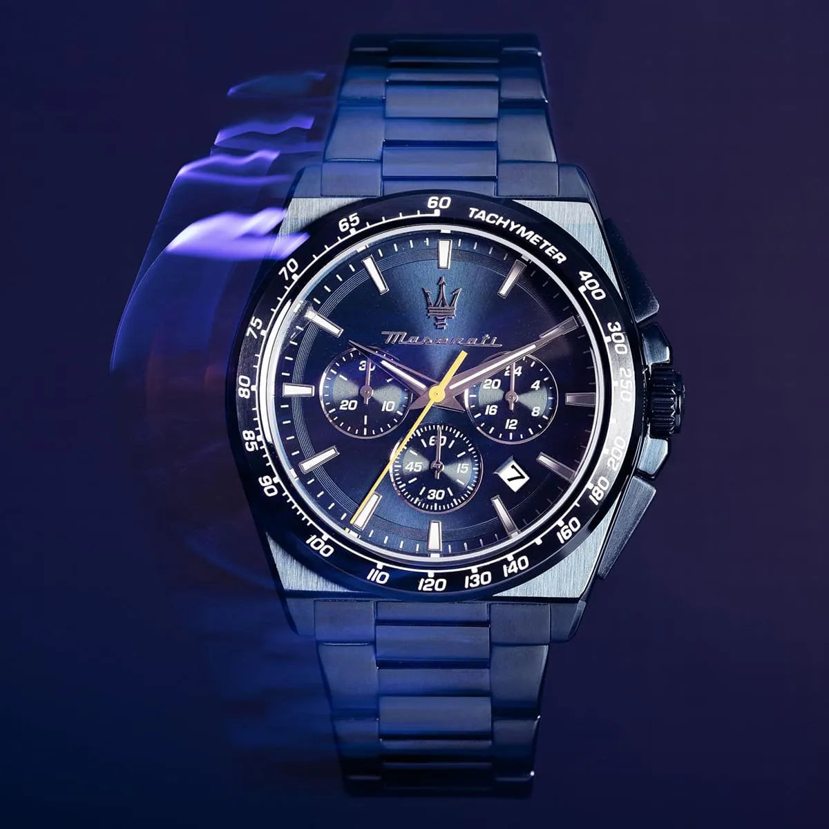 Maserati Velocità chronograph with blue dial and yellow accents on dark background
