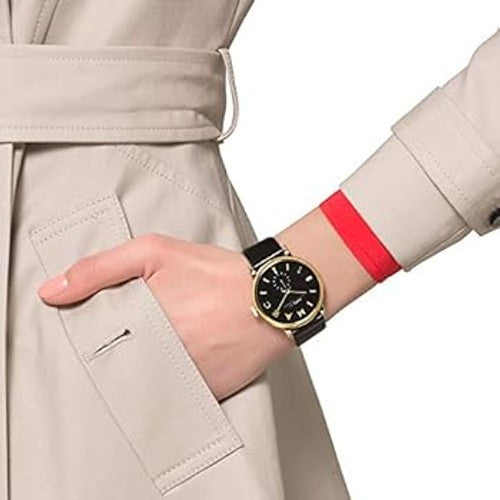 Marc by Marc Jacobs Baker MBM1269 watch worn on wrist with gold case and black dial visible