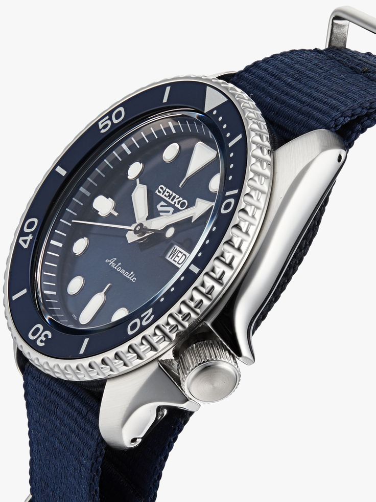 Seiko 5 Sports SRPD51K2 angled view showing silver case, blue bezel, and navy nylon strap