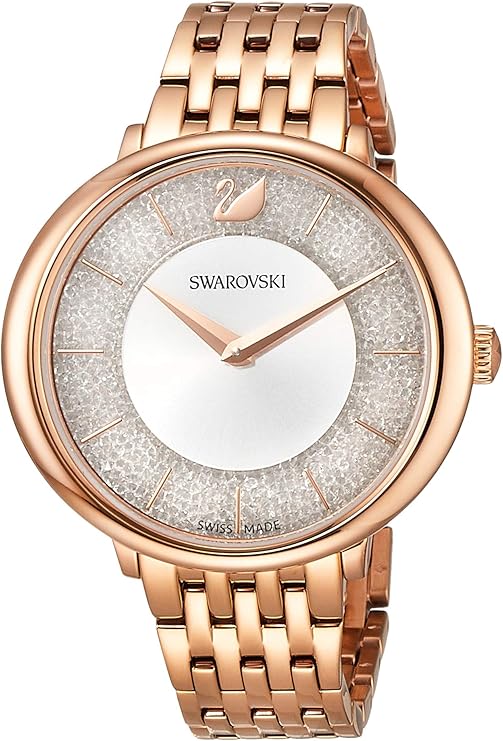 Angled view of Swarovski Crystalline Chic watch with crystal-set bezel and rose gold strap