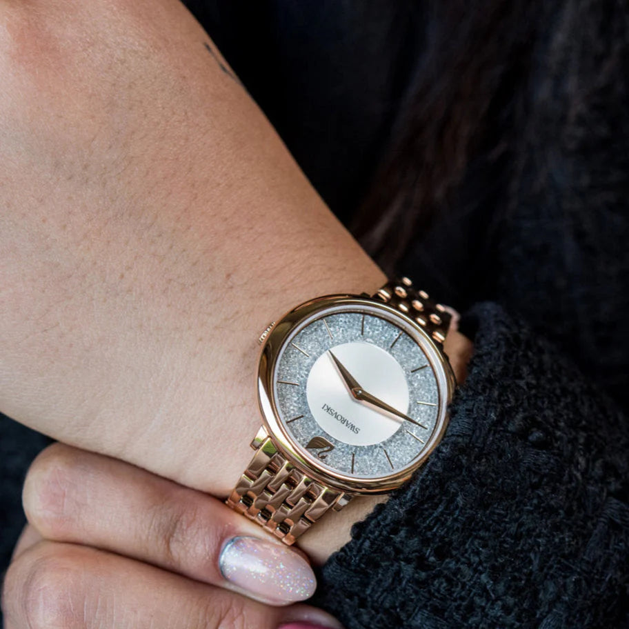 Swarovski Crystalline Chic watch worn on wrist with rose gold strap