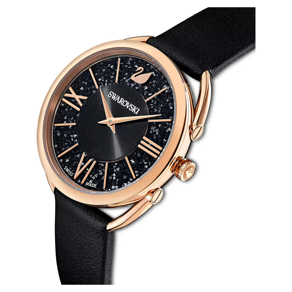 Swarovski Crystalline Glam watch angled view showing rose gold case and black leather strap