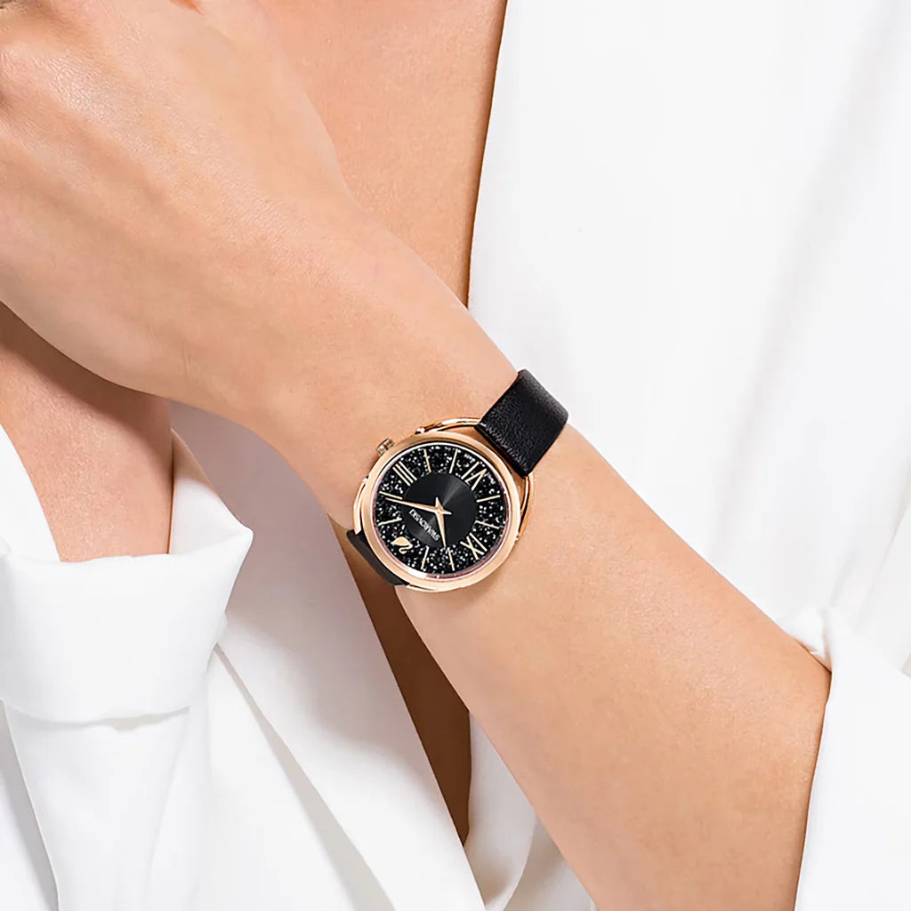 Swarovski Crystalline Glam women's watch worn on wrist with black leather strap