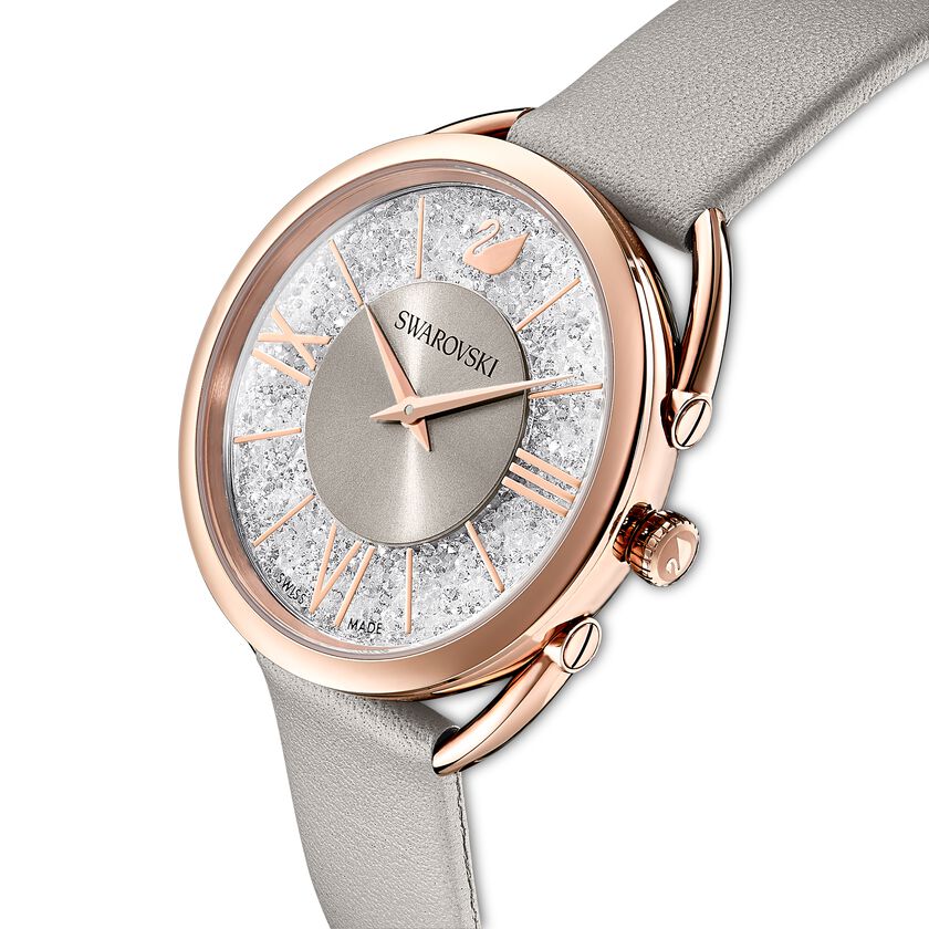 Angle view of Crystalline Glam watch with rose gold case and grey leather strap