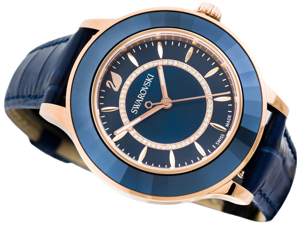 Angled view of Swarovski Octea Lux women's watch with blue dial and rose gold bezel