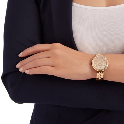 Rose gold Swarovski watch worn on wrist