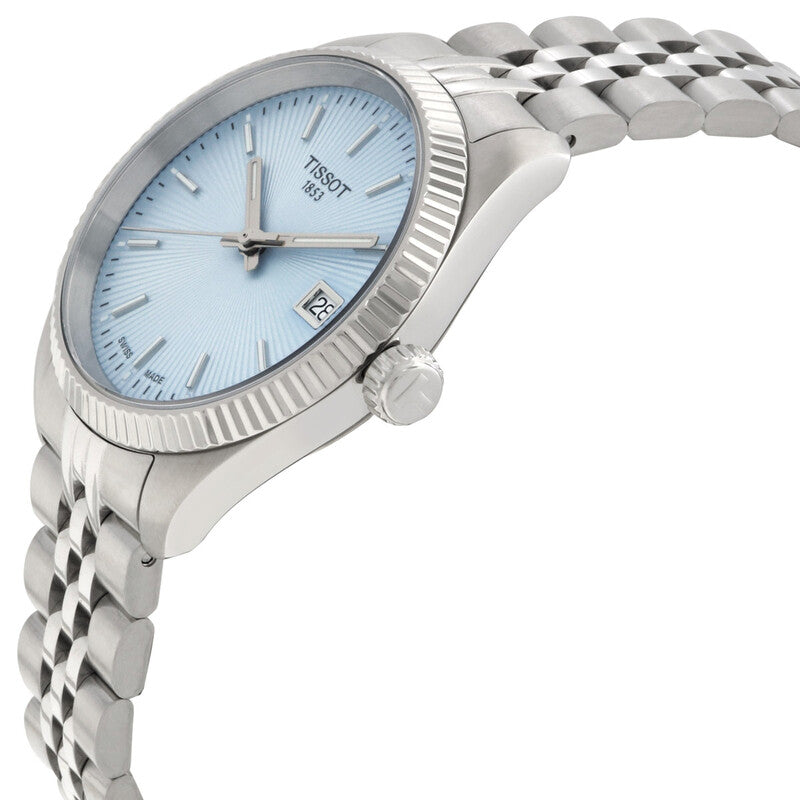 Tissot Ballade women's watch on wrist, showing light blue dial and silver strap details