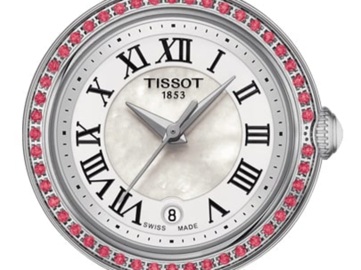 Close-up of Tissot Bellissima dial with Roman numerals, date window, and pink diamond bezel