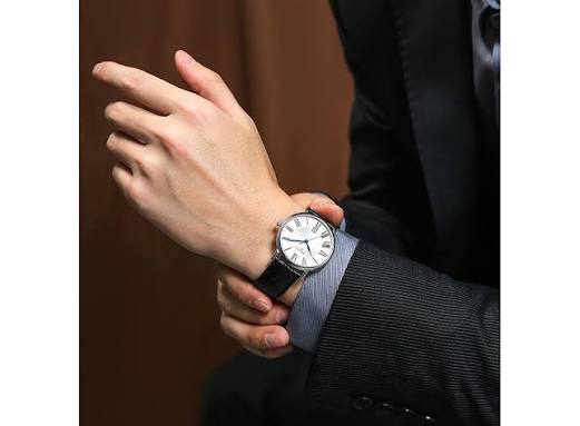 Tissot Carson Premium watch worn on wrist with silver dial and black strap