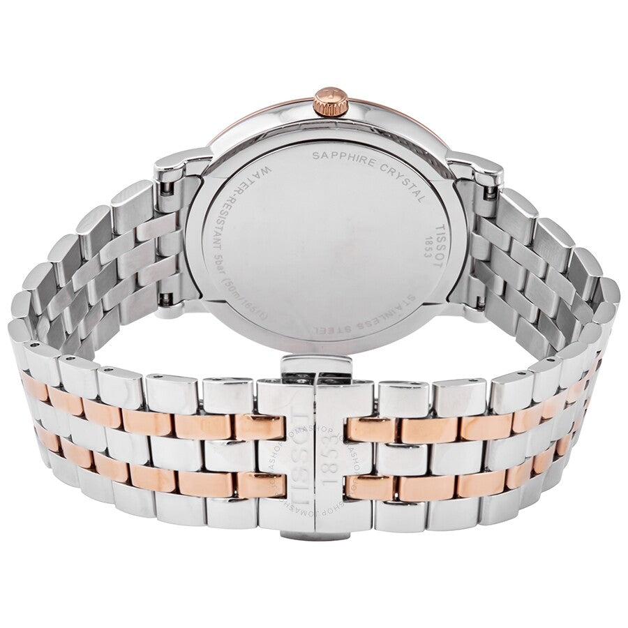 Tissot Carson Premium caseback showing steel and rose gold two-tone bracelet construction
