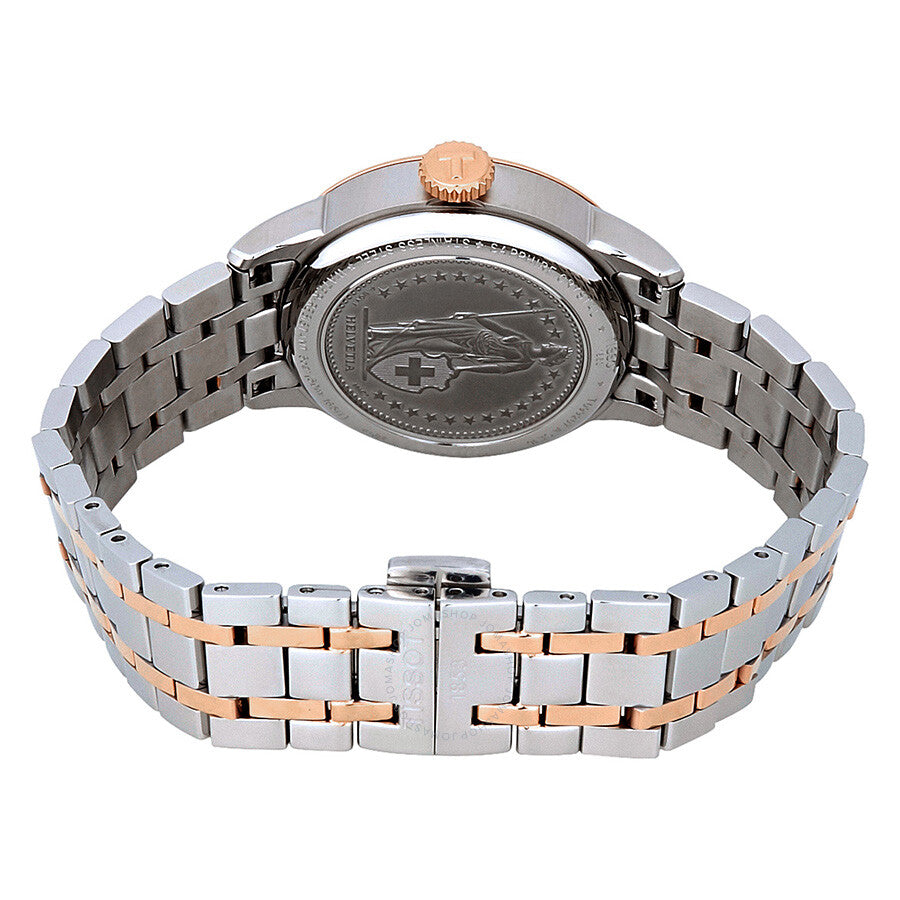 Tissot Chemin Des Tourelles watch caseback showing engraved design and two-tone bracelet