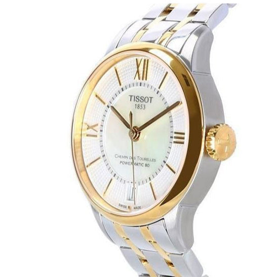 Tissot Chemin des Tourelles women's watch showing white dial with Roman numerals and two-tone steel and gold bracelet
