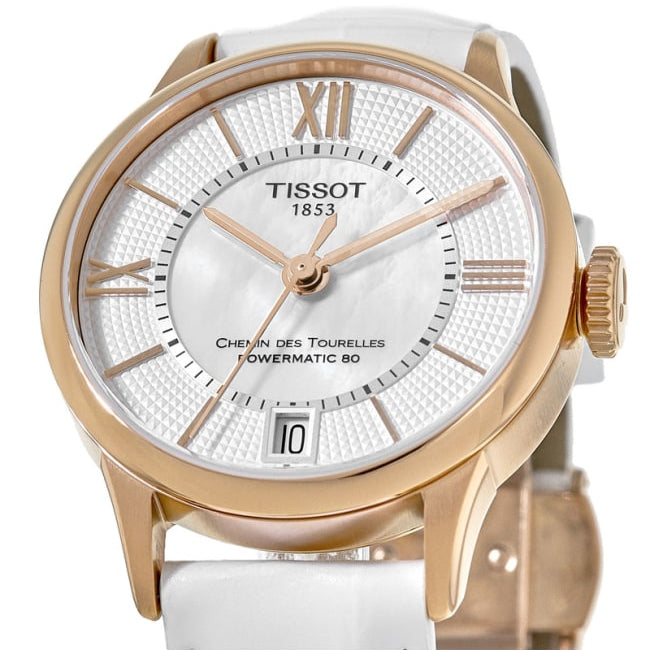 Close-up of Tissot Chemin Des Tourelles mother-of-pearl dial with Roman numerals and rose gold hands