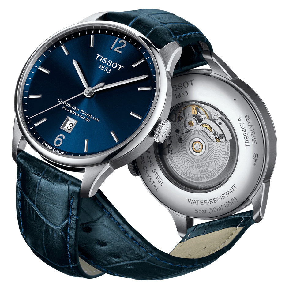 Tissot Chemin Des Tourelles watch showing blue dial and open caseback displaying Powermatic 80 automatic movement