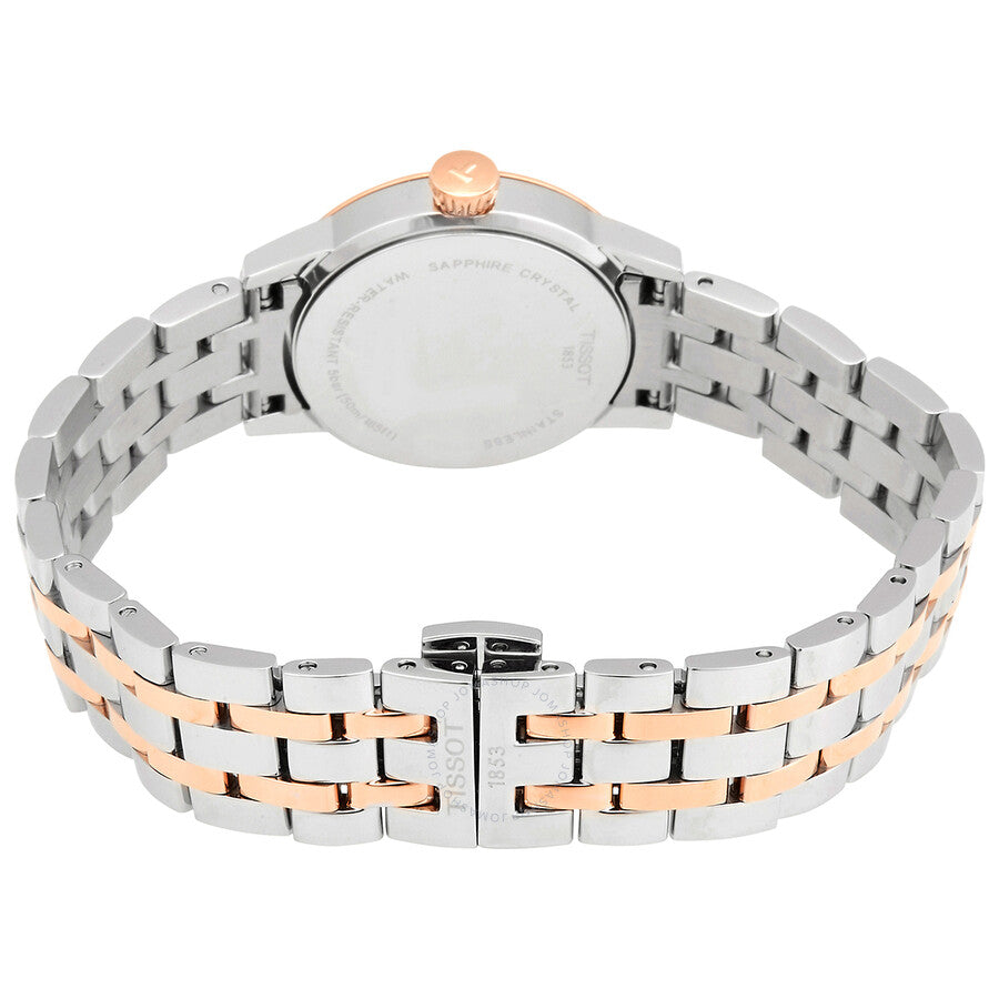 Tissot Classic Dream watch caseback view showing stainless steel and rose gold bracelet links