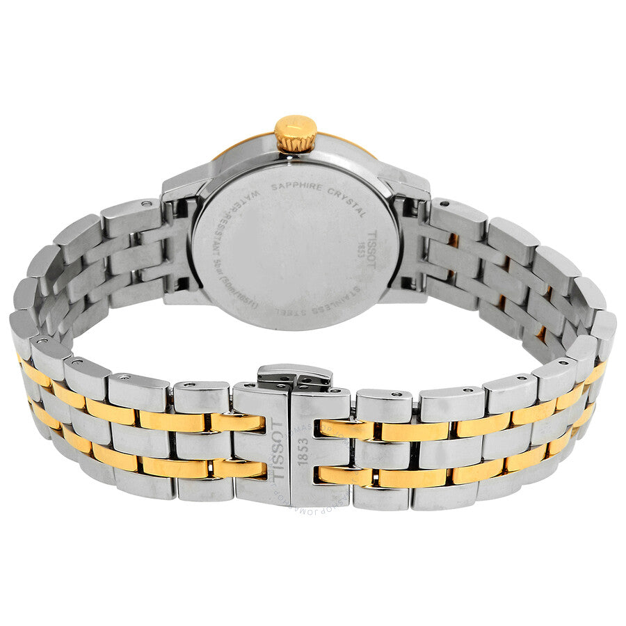Tissot Classic Dream caseback showing two-tone stainless steel and gold-tone bracelet with crown