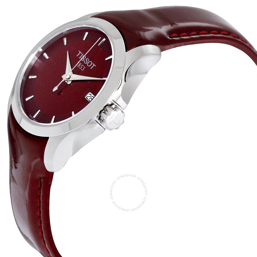 Tissot Couturier watch angled side view showing burgundy leather strap and case profile
